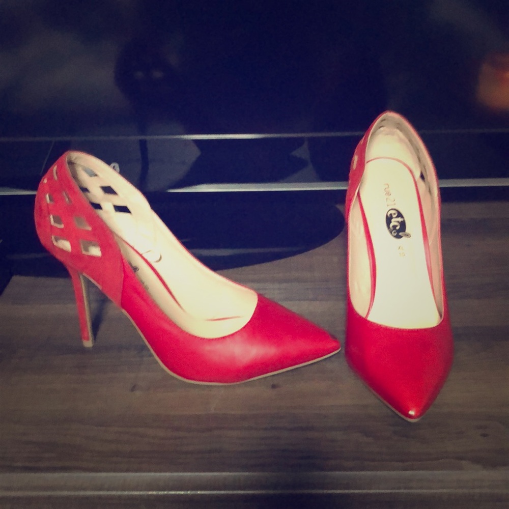 Red pumps.  Minor scuff on toe.